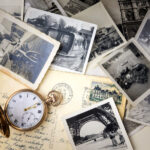 34224574 - pocket watch with old photographs and post cards