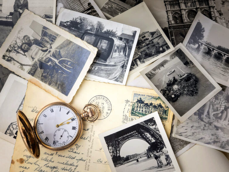 34224574 - pocket watch with old photographs and post cards